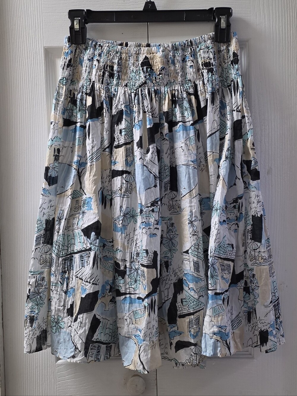 New York & Company blue, black, and beige abstract cityscape print cotton skirt